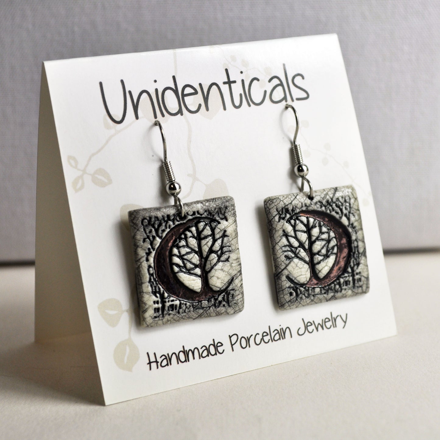 ems 725 crescent moon tree sq earrings on tent card.jpg